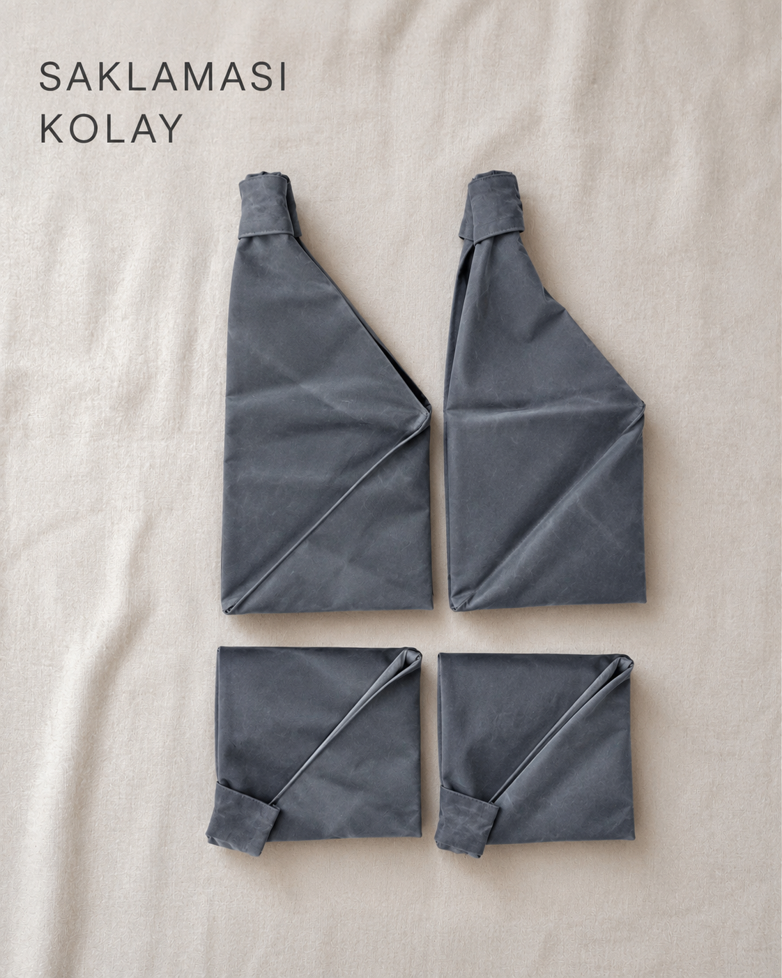 Waxed canvas origami bag, grey. Folded and easy to store.