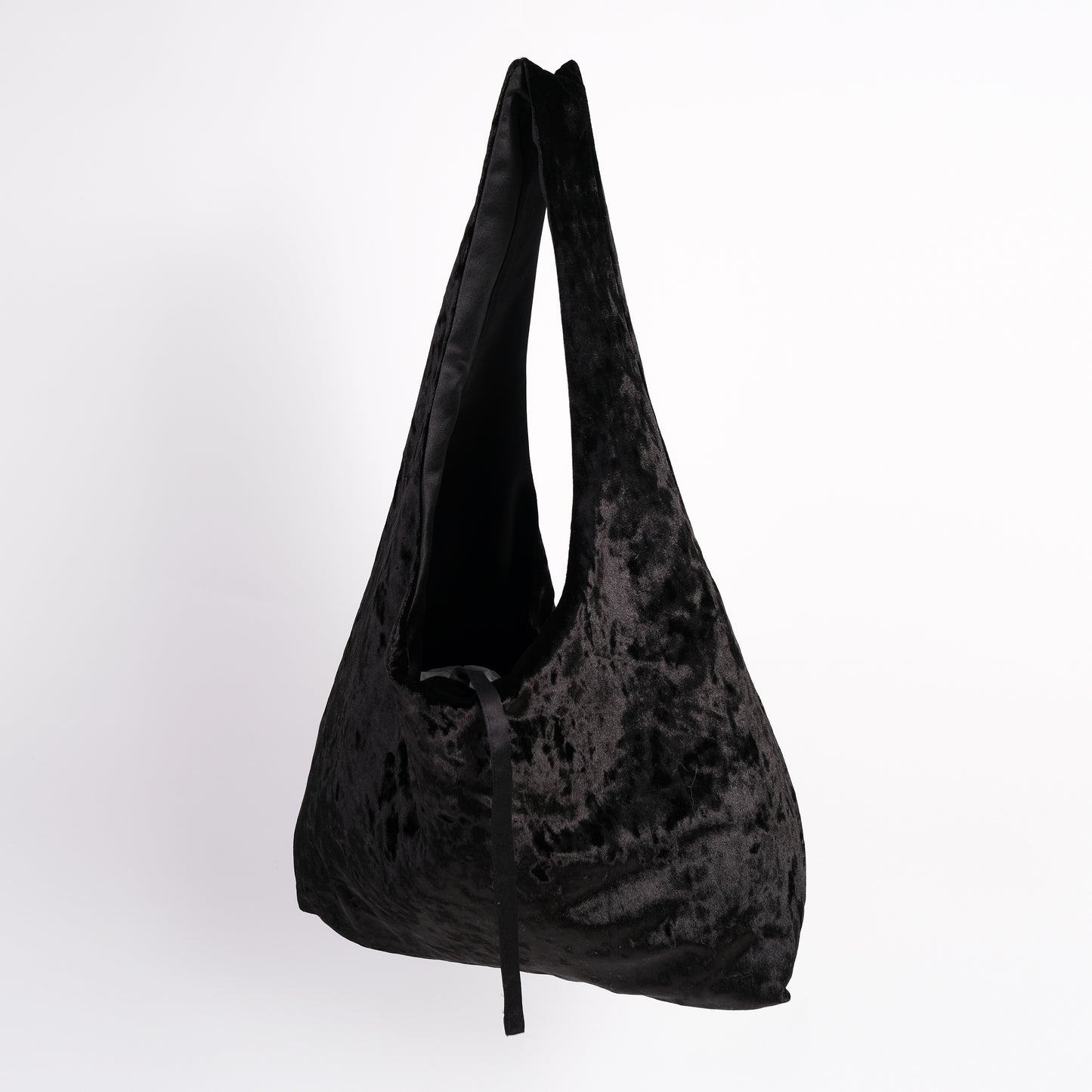 Black crushed velvet over the shoulder bag handmade in Turkey, Esra Kayira brand, hanging.