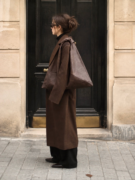 Dark brown waxed canvas origami midi bag by Esra Kayira brand.
