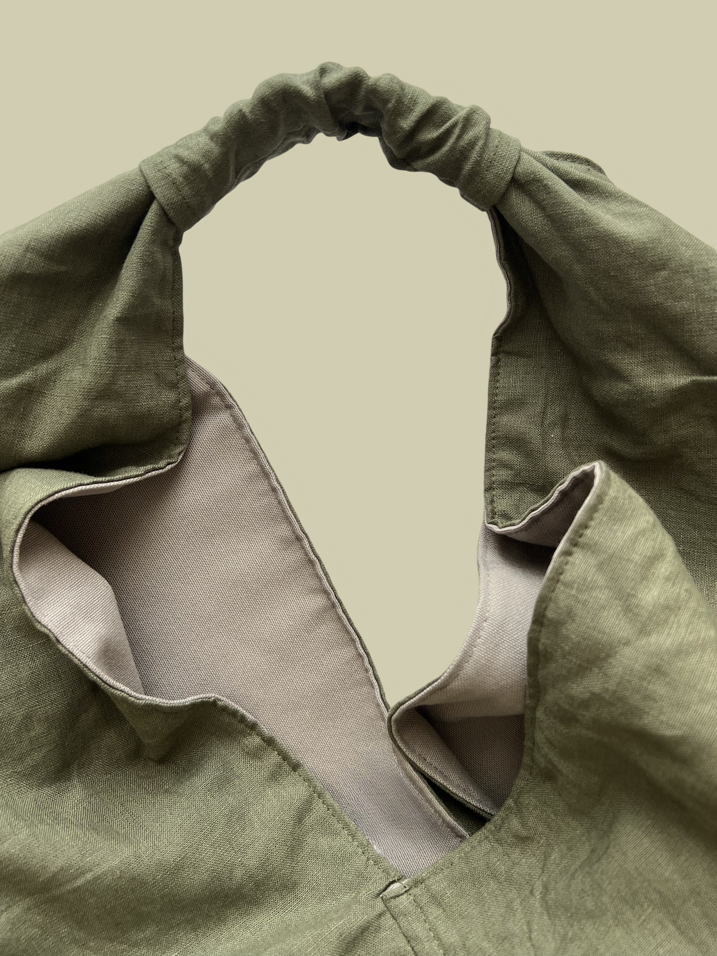 Olive green linen large origami bag handmade in Turkey, Esra Kayira brand, detail.