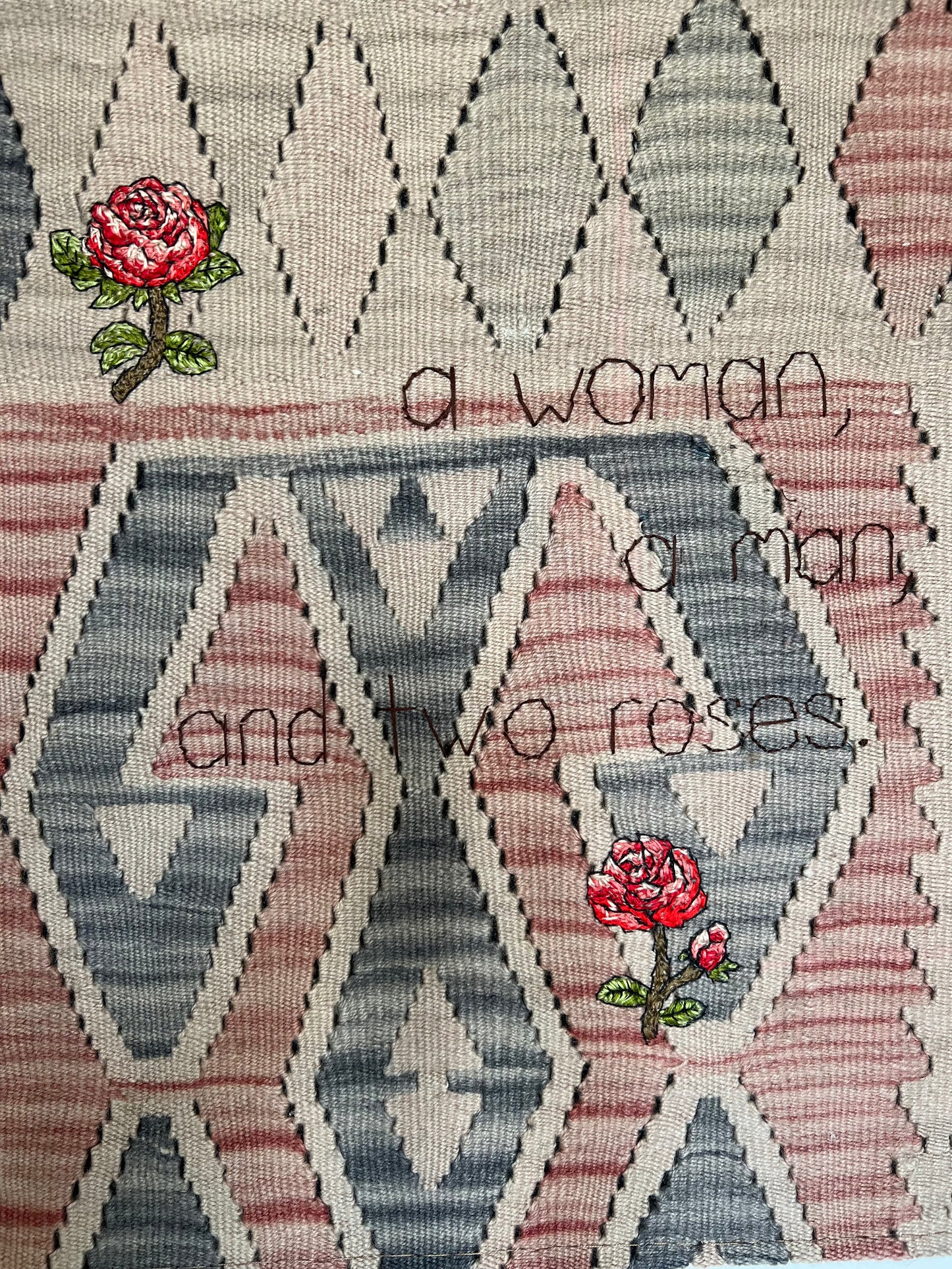 a woman, a man, and two roses.