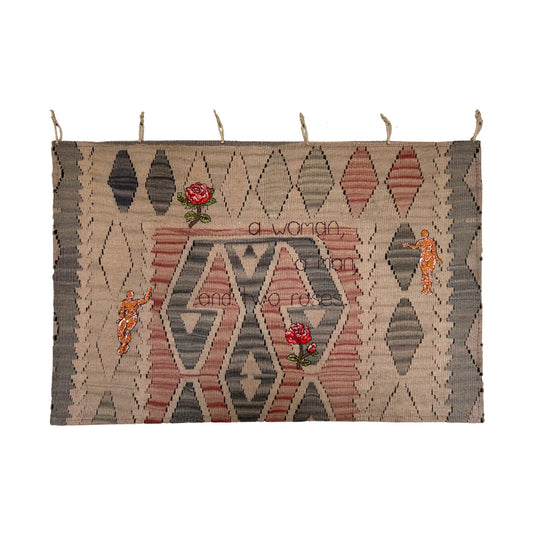 a woman, a man, and two roses.