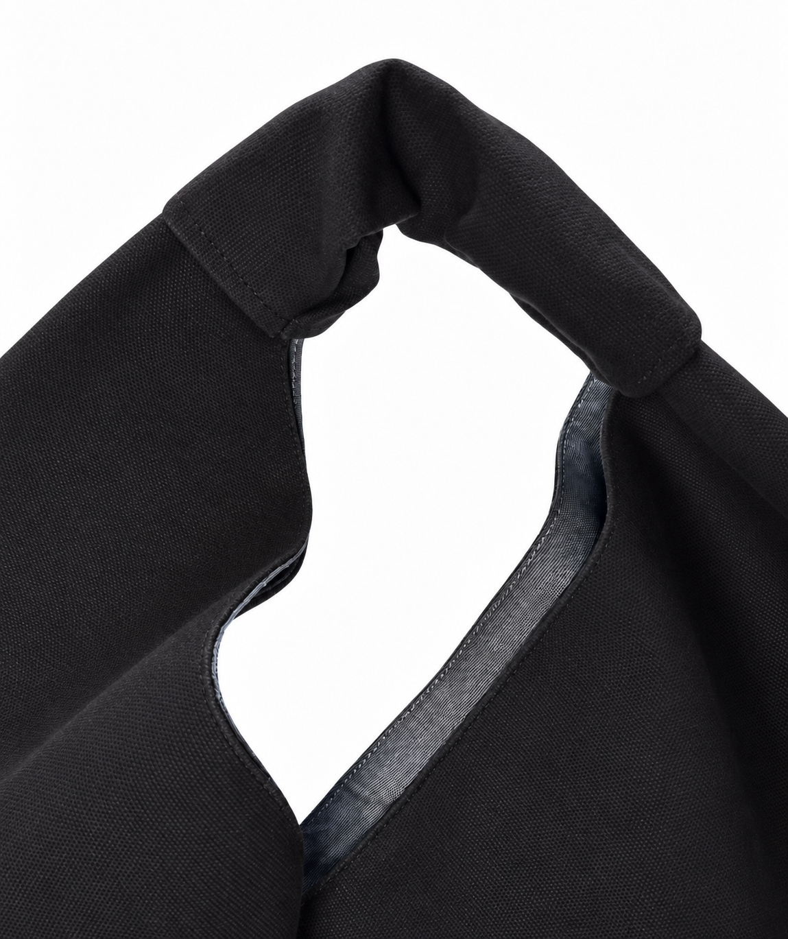 Black waxed canvas origami bag, detail. 