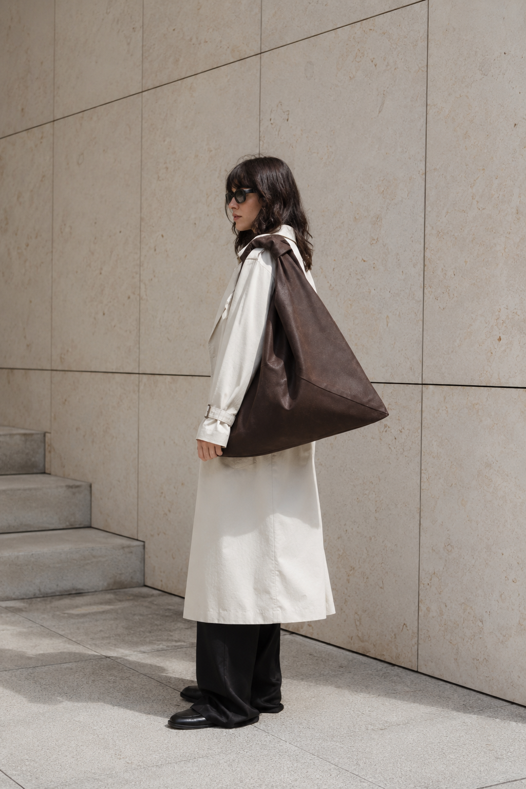 Dark brown waxed canvas origami midi bag by Esra Kayira brand.