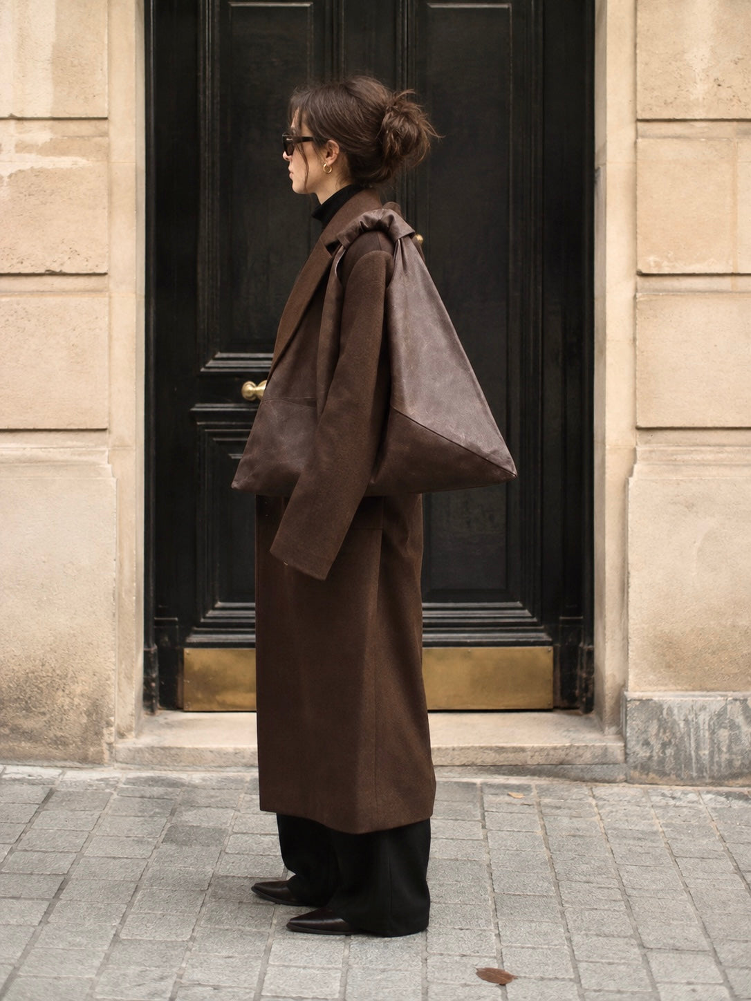 Dark brown waxed canvas origami midi bag by Esra Kayira brand.
