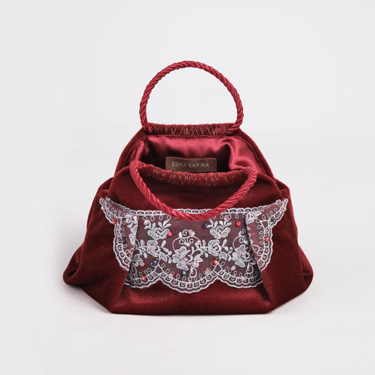 Mini burgundy velvet bag texture and handcraft detail
